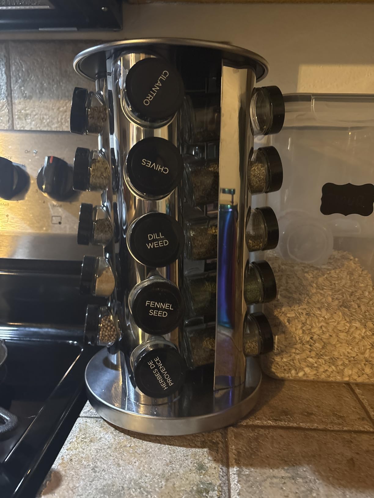 Kamenstein 20 Jar Revolving Countertop Spice Rack with Spices Included, FREE Spice Refills for 5 Years, Polished Stainless Steel with Black Caps, 30020 customer photo 1