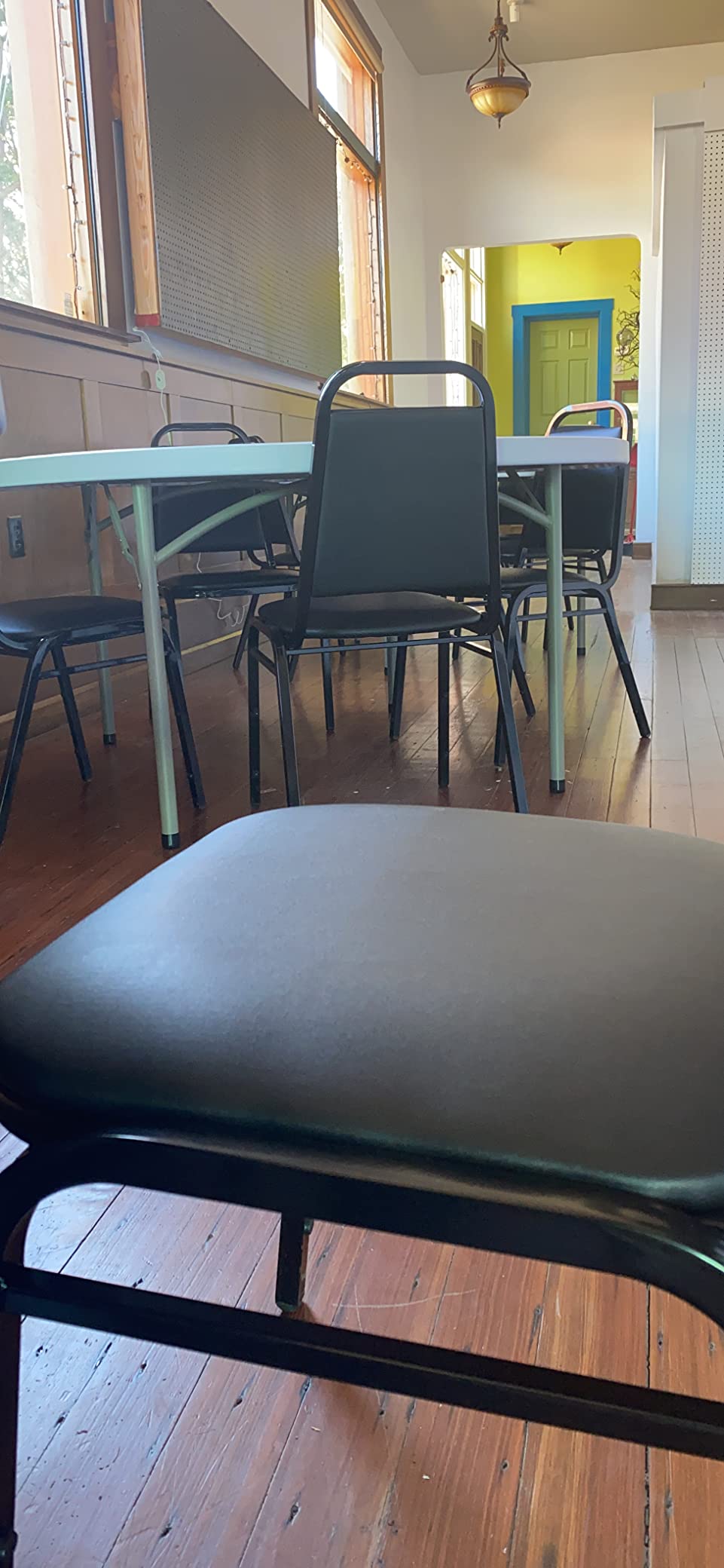 Flash Furniture Hercules Set of 4 Trapezoidal Vinyl Stacking Chairs, Commercial Stackable Chairs with Padded Seats and Backs, Black customer photo 1
