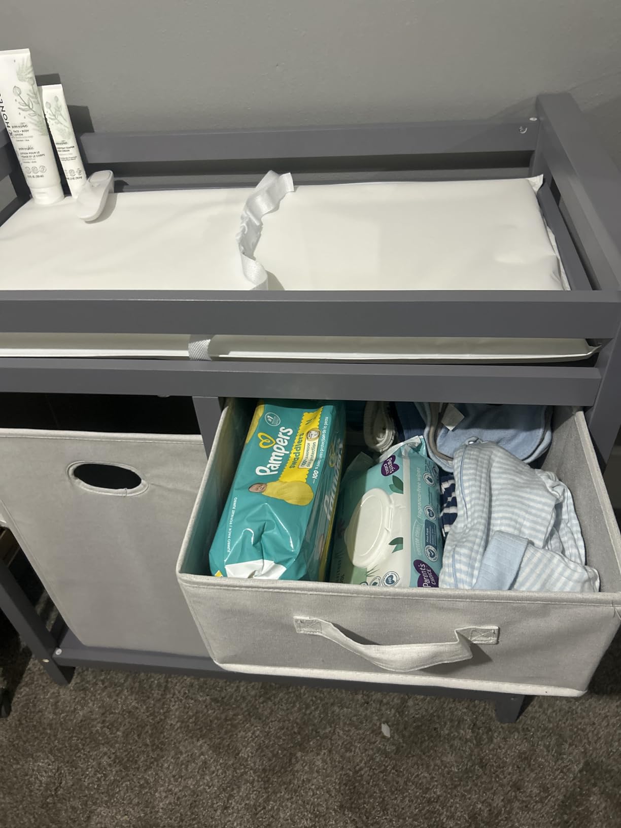 Badger Basket Modern Baby Changing Table - Nursery Furniture with Laundry Hamper and 3 Storage Drawers - Diaper Changing Station with Safety Belt, Changing Pad, and Organizer Baskets - Gray and White customer photo 1