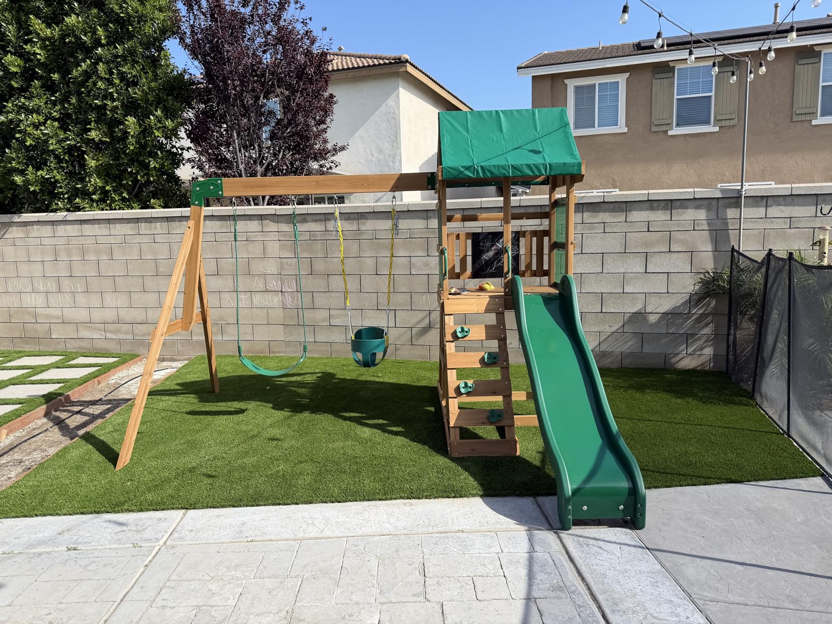 Backyard Discovery Buckley Hill Cedar Wood Swing Set with Wave Slide, Play Deck, Rock Wall Ladder, Belt Swings, Chalkboard, Canopy Roof, Outdoor Playset customer photo 2