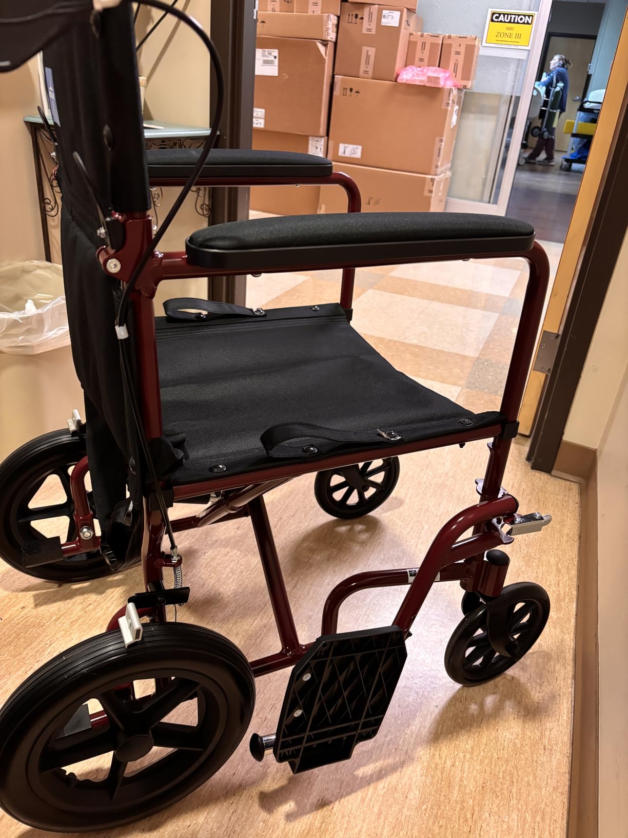 Medline Lightweight Foldable Transport Wheelchair with Handbrakes and 12-Inch Wheels, Red Frame, Black Upholstery customer photo 1