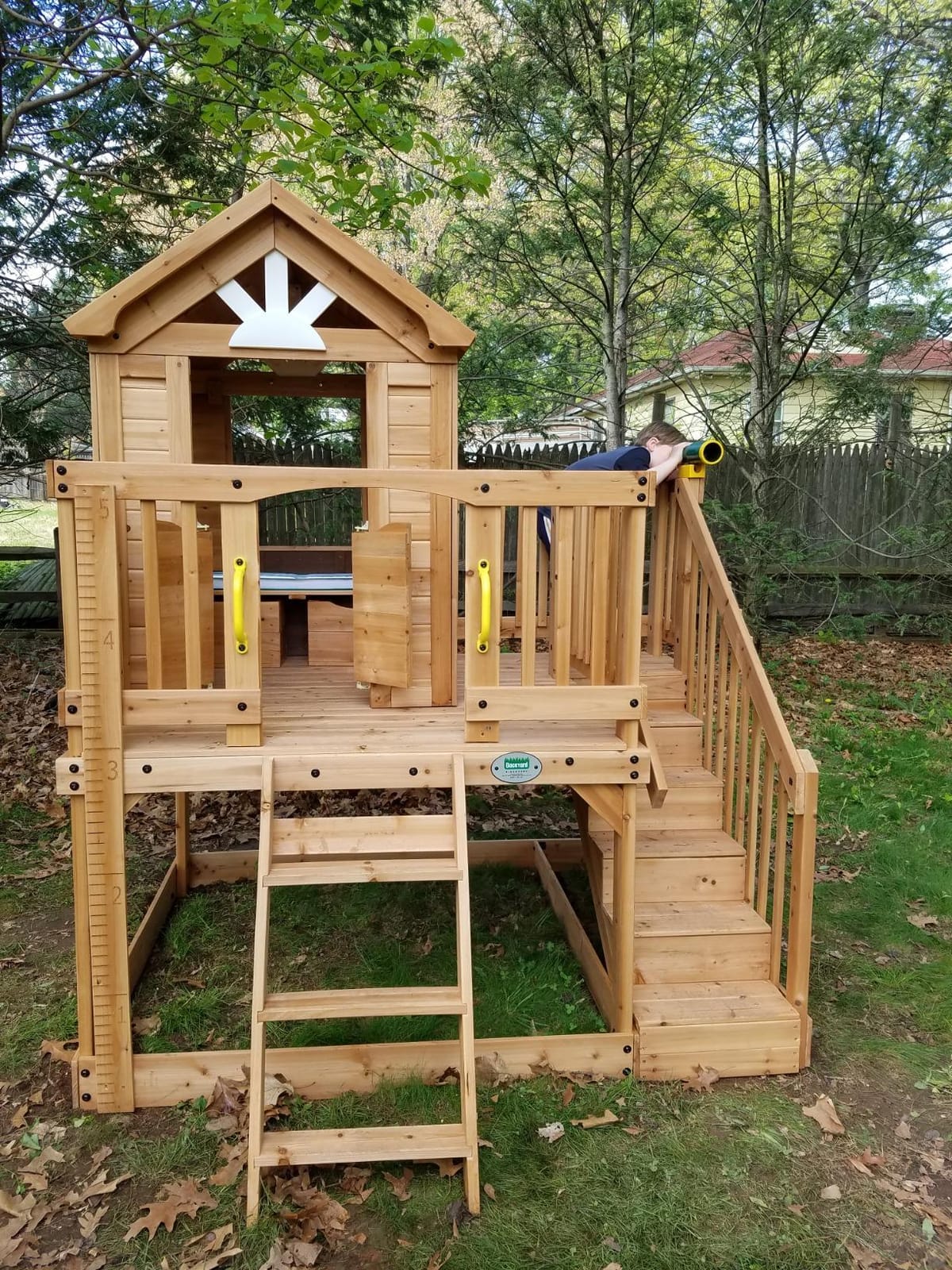 Backyard Discovery Scenic Heights Elevated Cedar Wooden Kids Playhouse with Play Kitchen, Wrap-Around Deck, Toy Storage Bench, Saloon-Style Doors, Ladder, Stairs, and Growth Chart for Outdoor Play customer photo 1