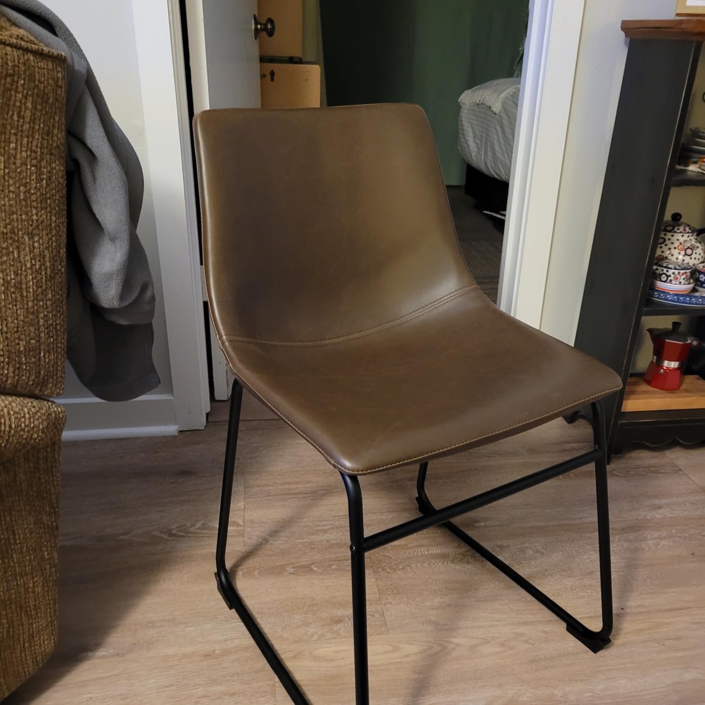 Signature Design by Ashley Centiar Mid-Century Dining Chair Set of 2, Brown | Contoured faux leather bucket seats, Matte black tubular metal base, Optimized for compact kitchen and eat-in spaces customer photo 1