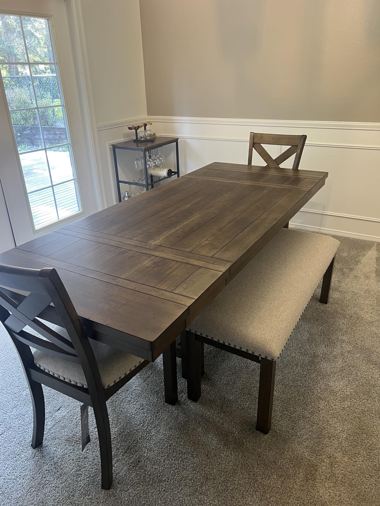 Signature Design by Ashley Moriville Wood Upholstered Dining Bench, Beige | Cushioned 48-inch dining seat in textured beige polyester, Rustic distressed nutmeg wood frame with bronze nailhead trim customer photo 1