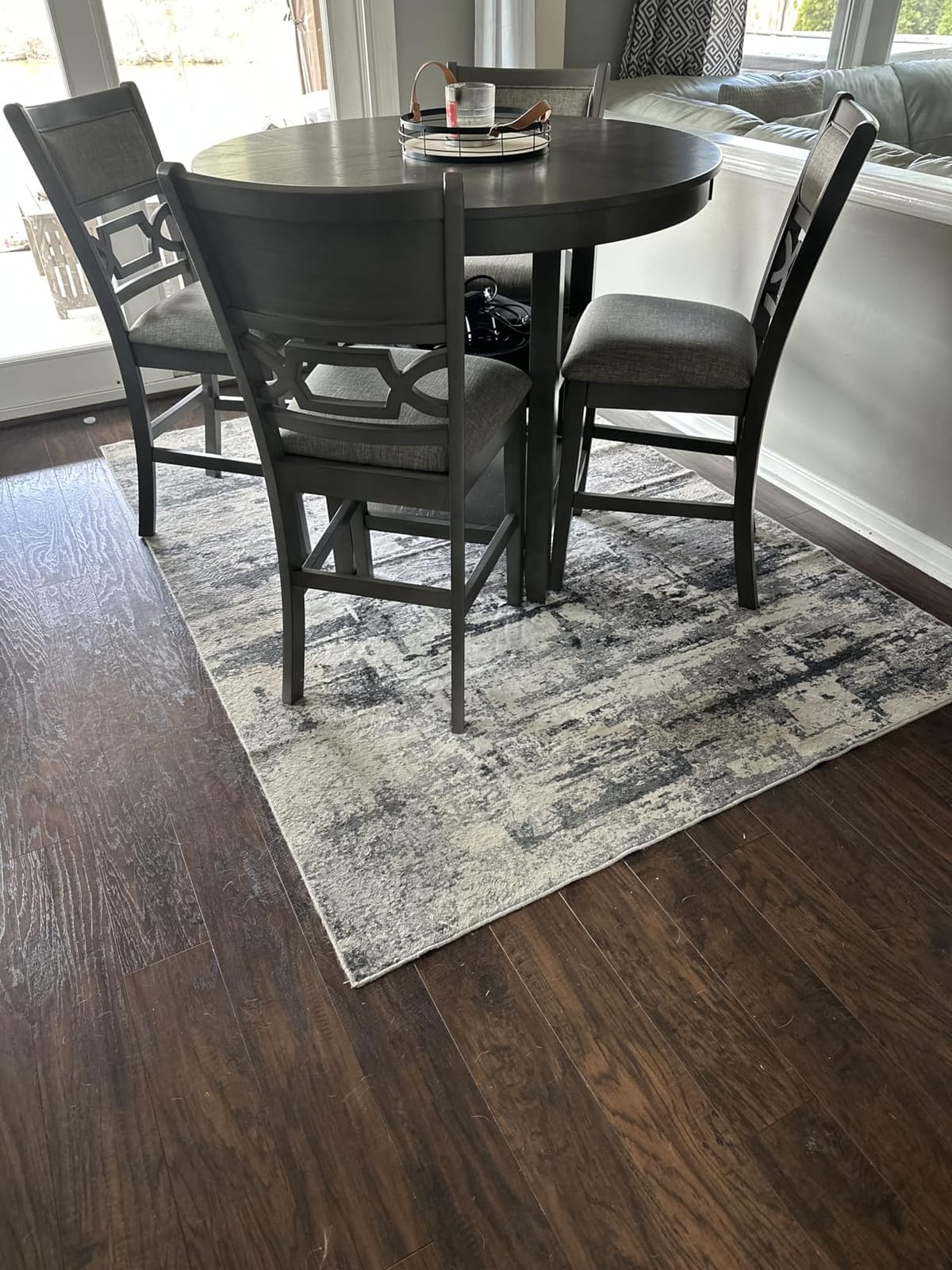 Signature Design by Ashley Round Dining Table Set for 4, Counter Height, 42-inch round table with built-in storage shelves, 4 foam-cushioned light gray barstools, Antique white finish, Erinberg customer photo 2