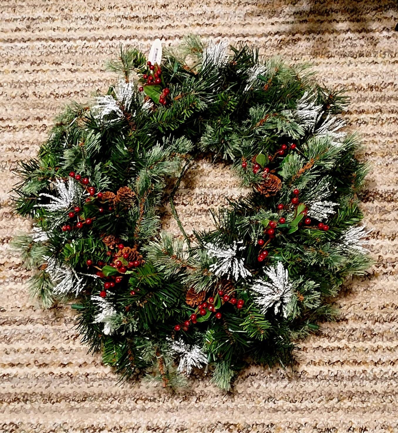 National Tree Company 24in Pre-Lit Wintry Pine Artificial Christmas Wreath | 50 Clear Lights, 113 Tips, Christmas Decoration with Pinecones, Red Berries, Snowy Bristle, Green customer photo 2