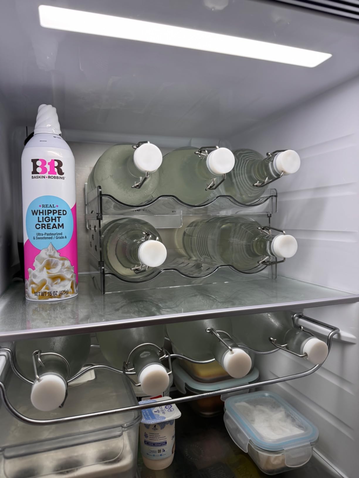 IEEK Plastic Stackable Bottle Storage Holder Rack Holds 16 Bottles,Free-Standing Water Bottle/Wine and Drink Organizer Shelf for Kitchen Cabinet,Fridge,Countertop,Pantry,Freezer,4 PackX4 Bottles,Clear customer photo 1
