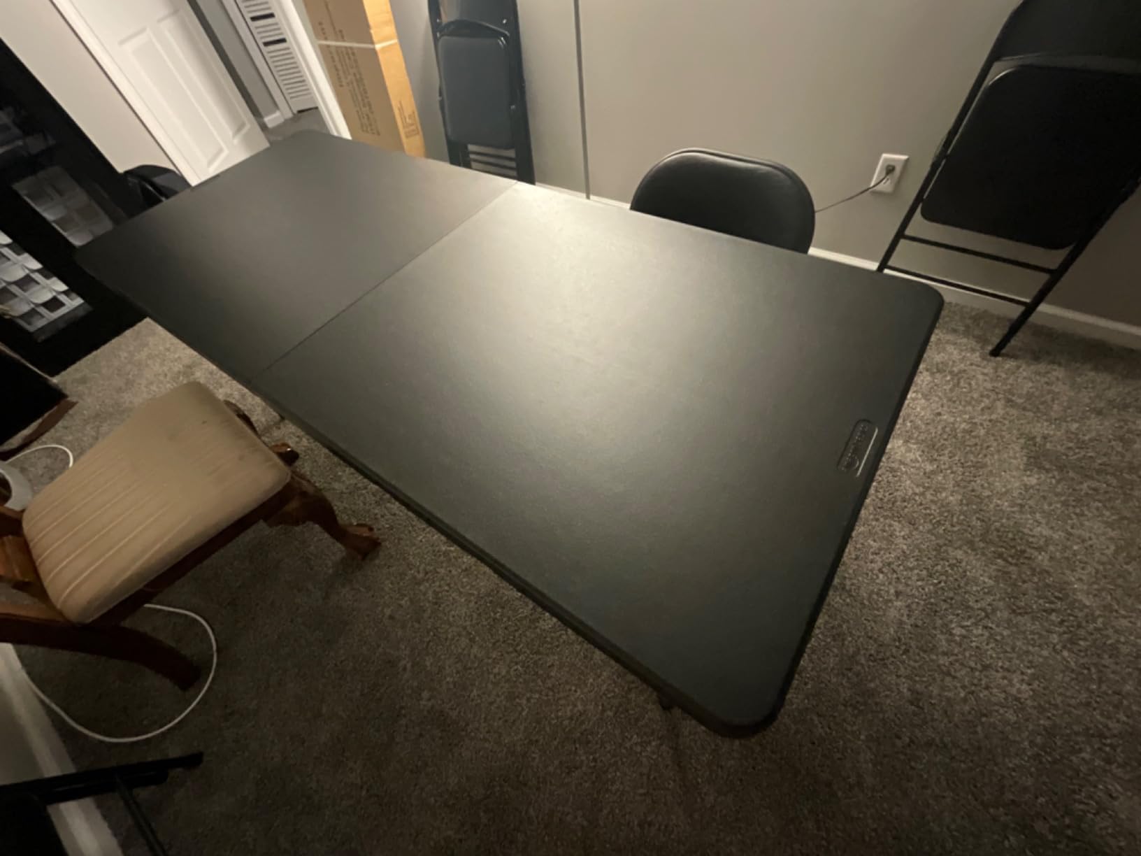 Amazon Basics Heavy Duty Portable Folding Table, 6 ft, Indoor & Outdoor, Fold-in-Half Design with Carrying Handle, for Events, Easy Folding and Storage, Black customer photo 1